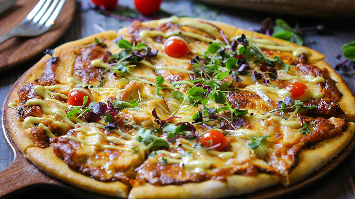 A pizza topped with microgreens