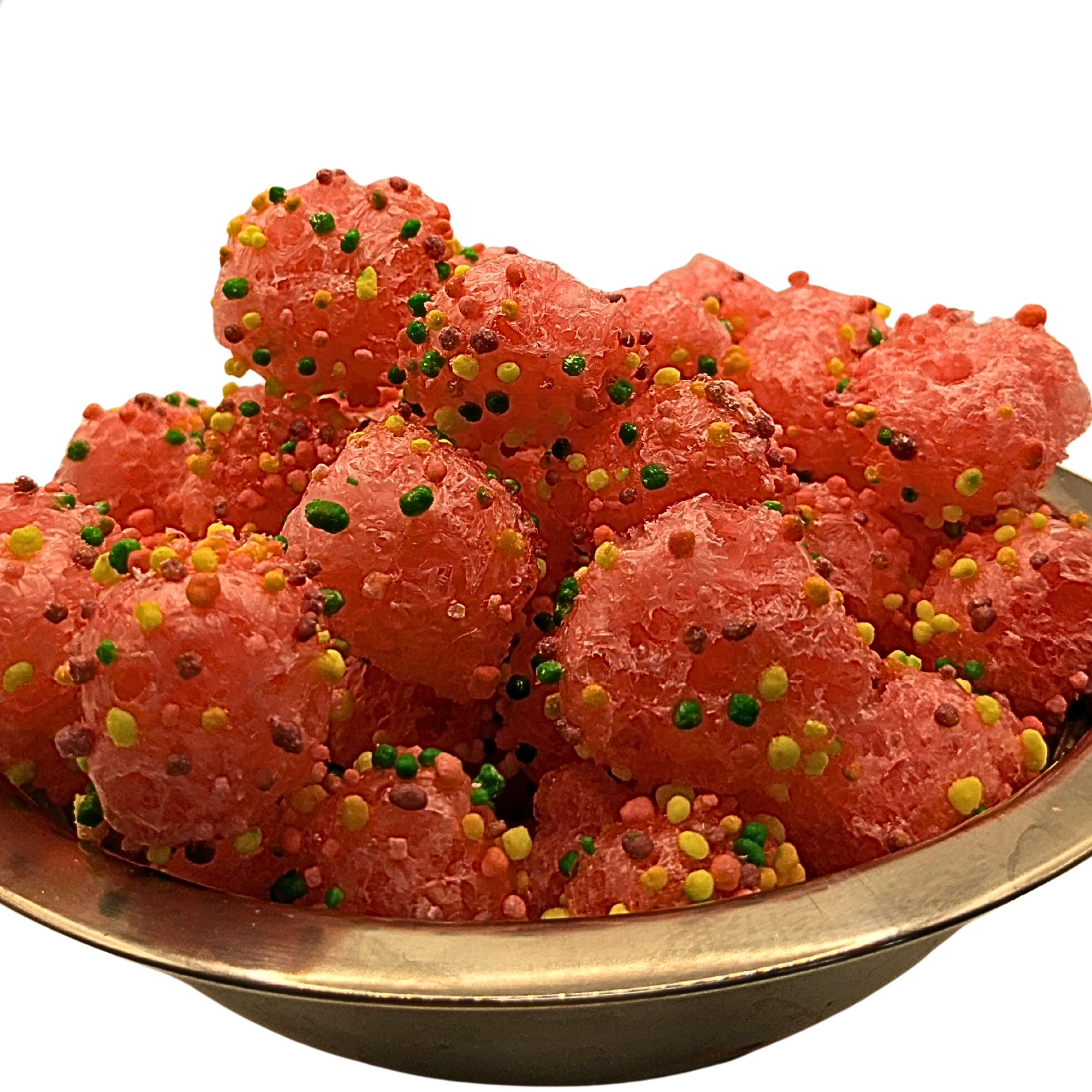 A close-up of pink, crunchy candy sprinkled with colorful round sprinkles, served in a metal bowl against a white background.