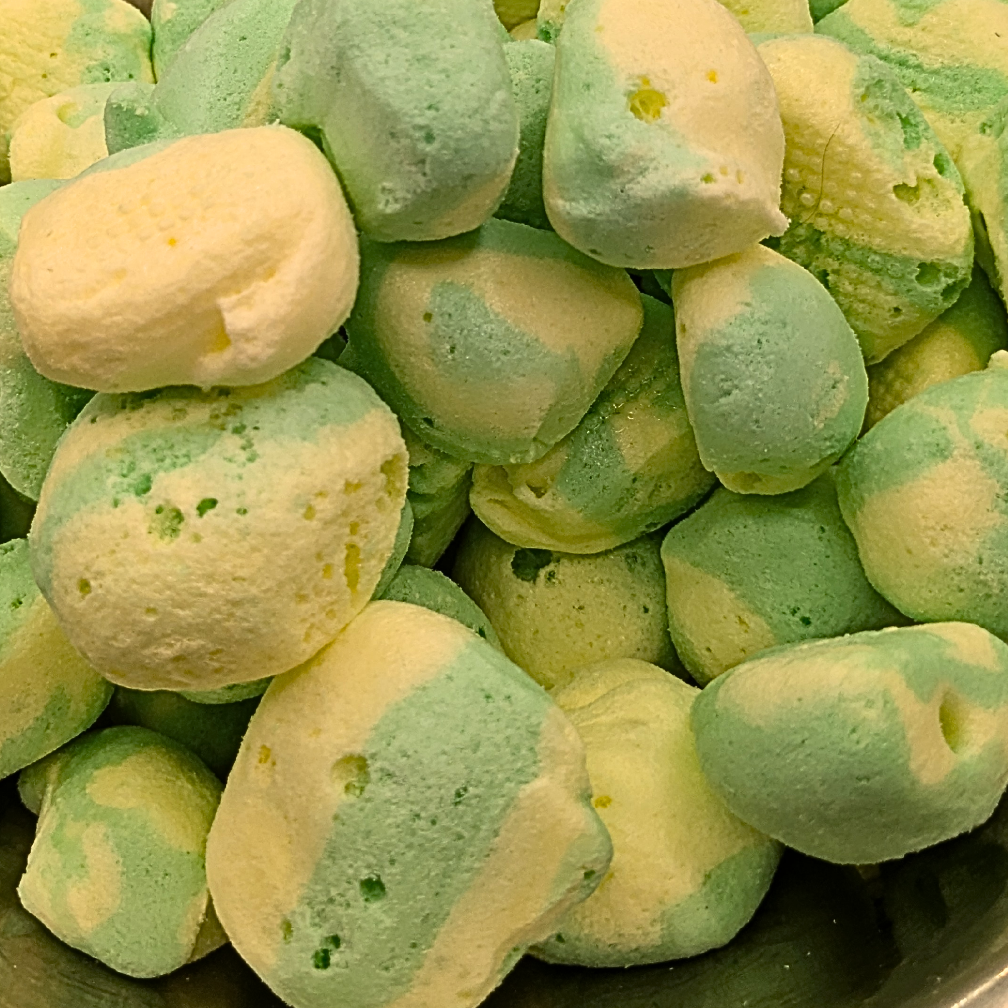 A bowl full of freeze dried pineapple taffy