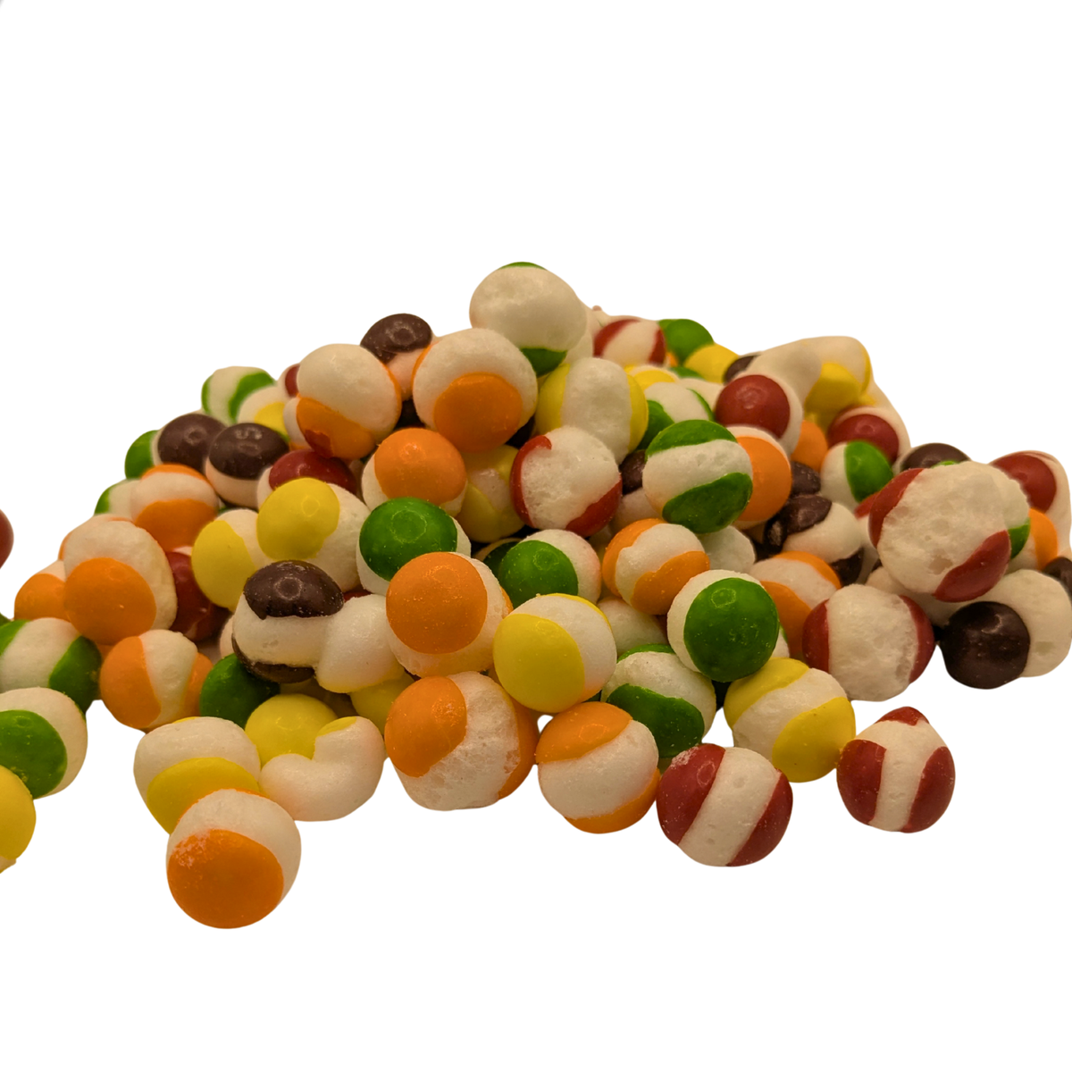 A pile of freeze dried spherical candy with a white center and yellow, orange, red, green, and purple shells