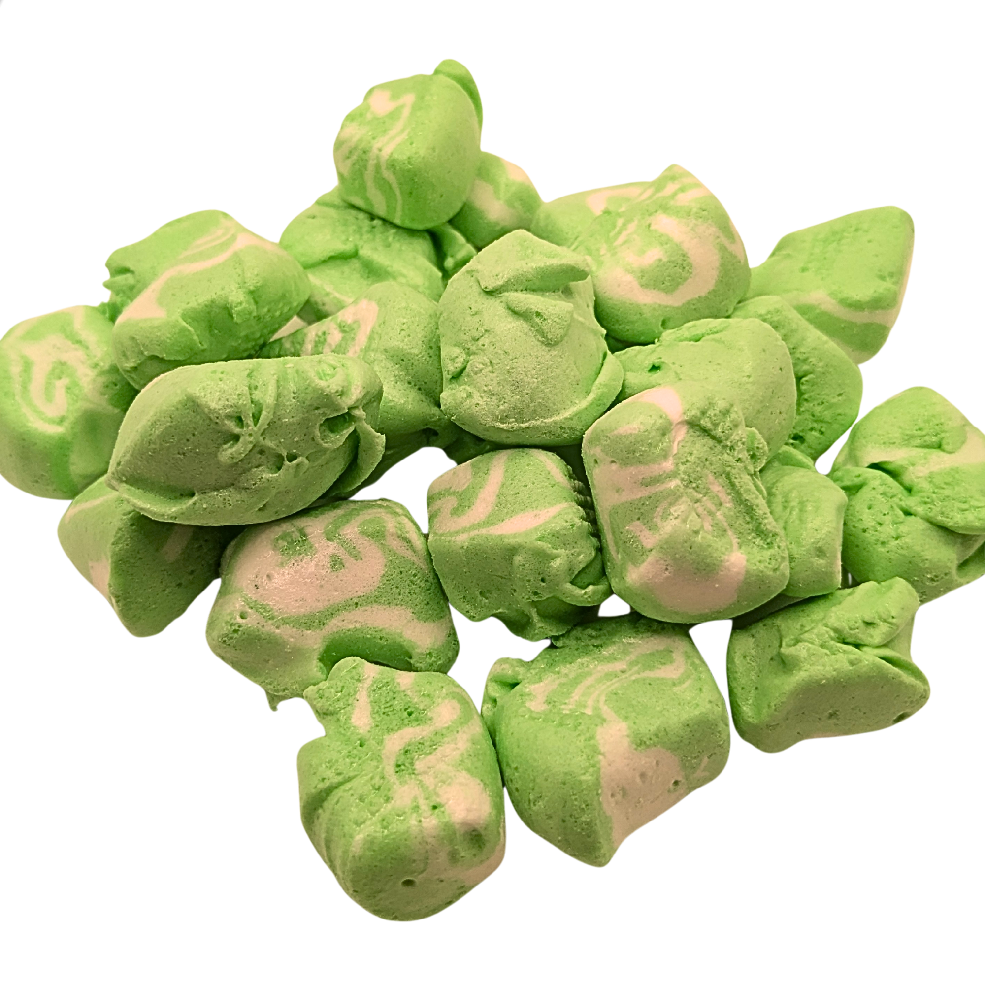 Pile of freeze dried key lime taffy on a white background
