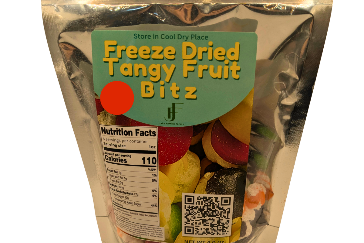 A 4 oz stand-up pouch of Freeze Dried Tangy Fruit Bitz, featuring a metallic silver foil bag with a green label and a clear window showing the colorful freeze-dried fruit pieces inside.