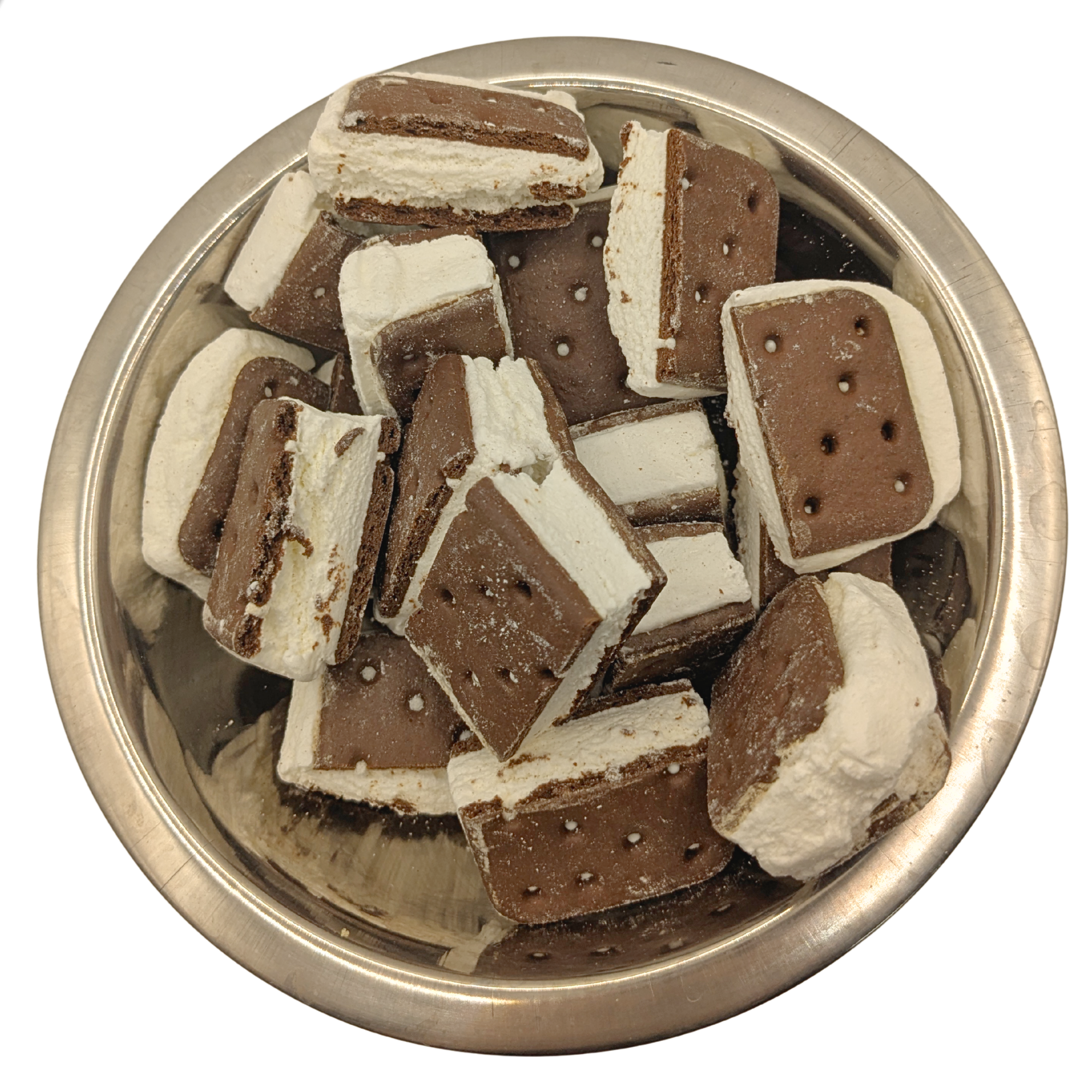 A top-down view of chocolate ice cream sandwich cookies cut into pieces and piled in a round silver metal bowl on a white background.