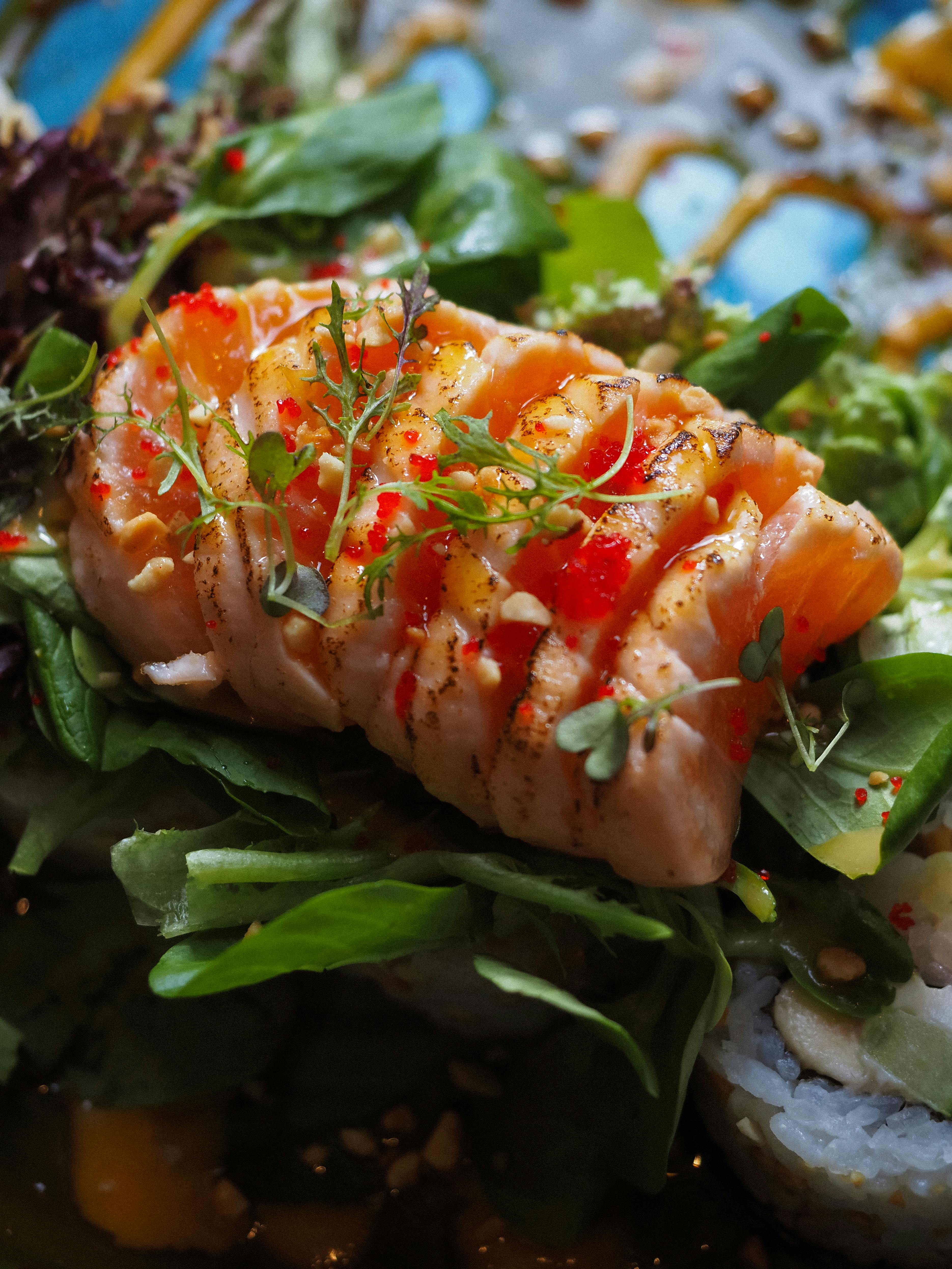 Sashimi on leaves garnished by microgreens