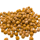 A pile of roasted freeze dried chickpeas with a golden-brown color and textured skins, arranged on a solid white background.