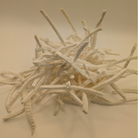 A pile of freeze dried jicama on a white background