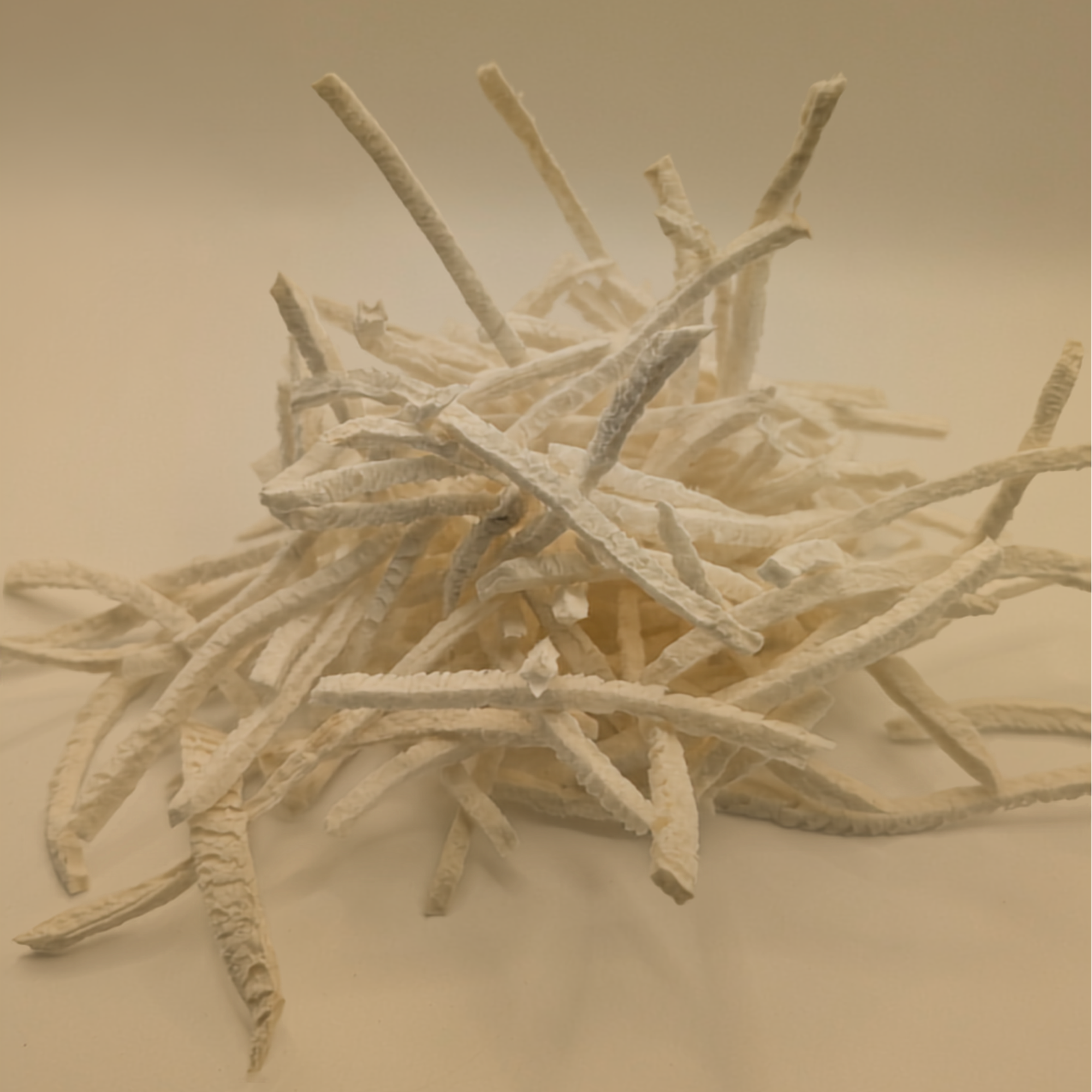 A pile of freeze dried jicama on a white background