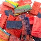 Ribbon Bitz, which are a rectangular freeze dried candy that's mostly red with some indigo, green, and orange pieces
