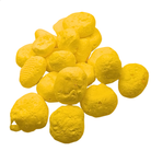 Pile of freeze dried banana taffy on a white background