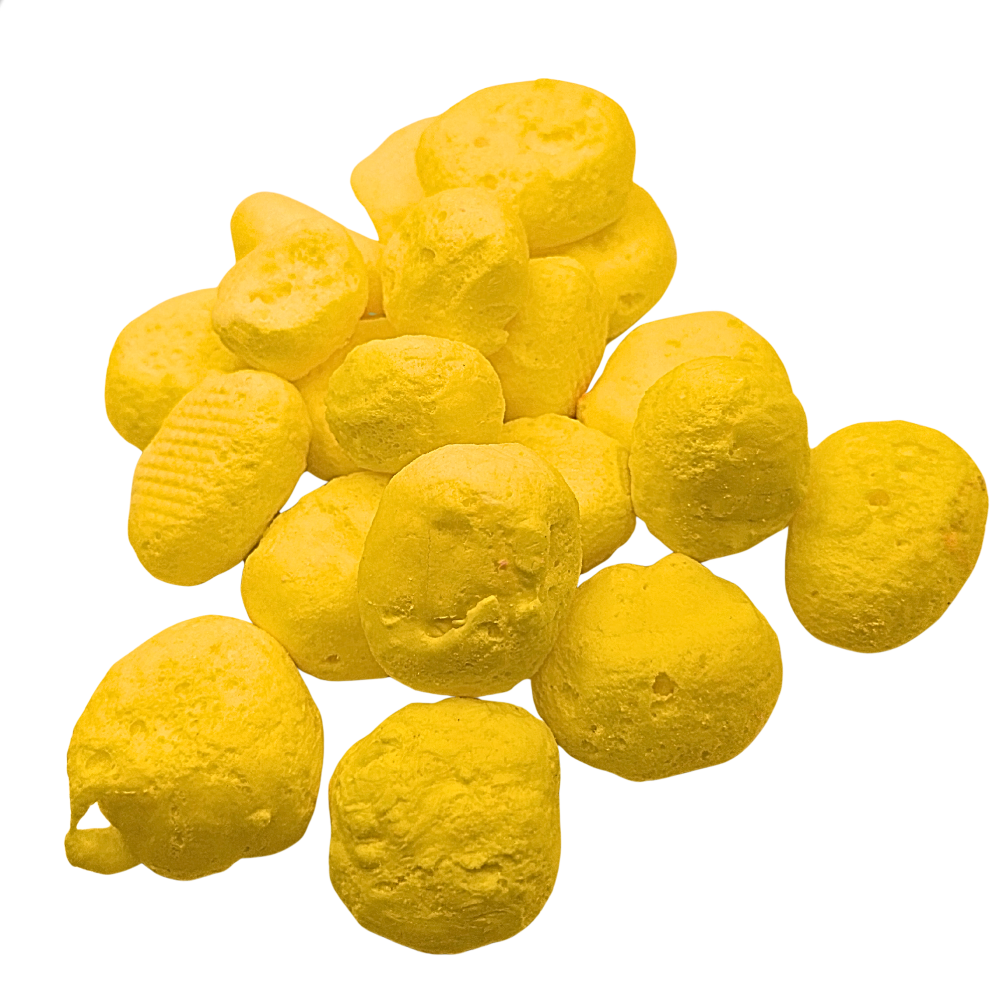 Pile of freeze dried banana taffy on a white background