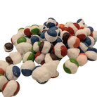 A pile of small round candy, photographed on a plain white background.