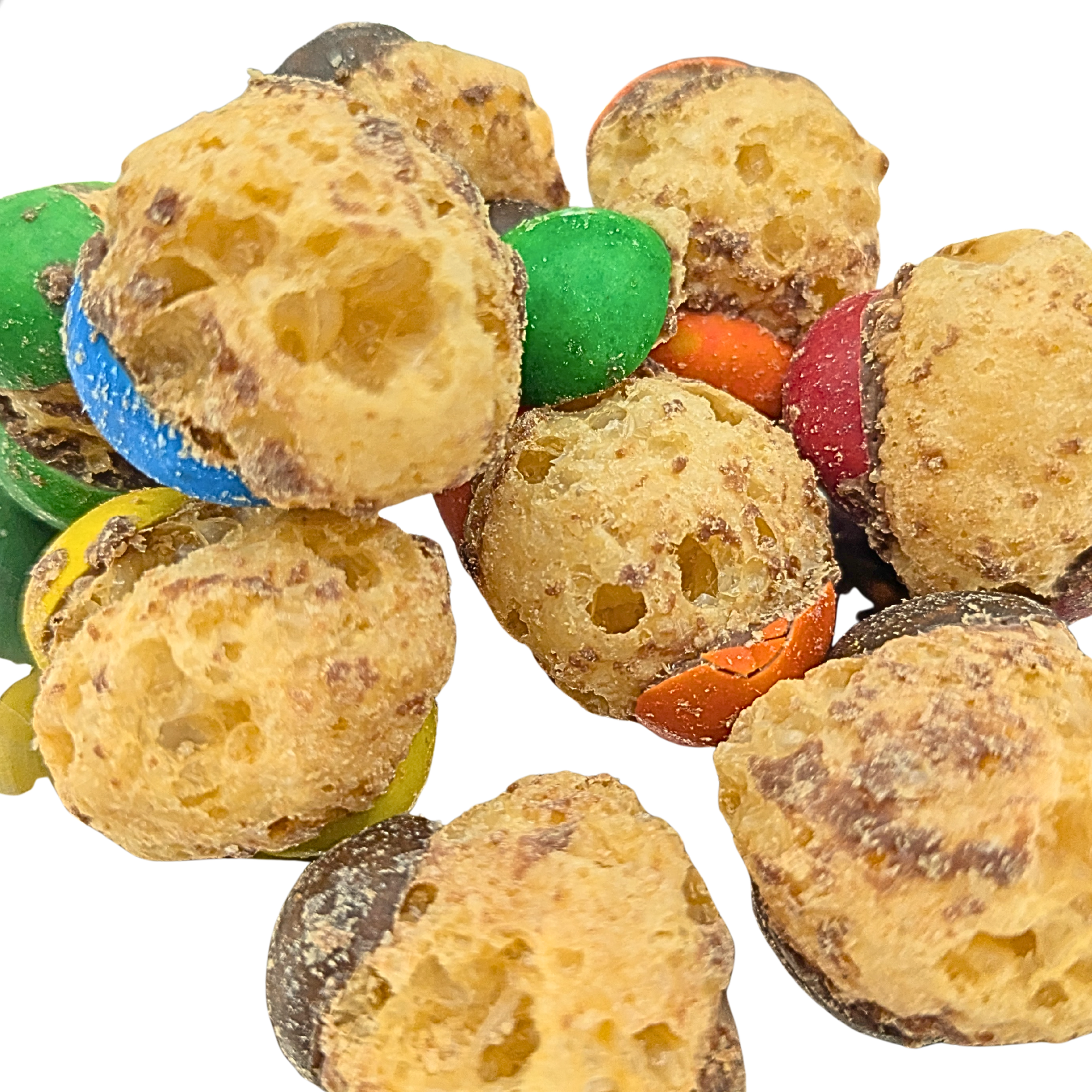 Colorful freeze dried caramel and chocolate candy on a white background