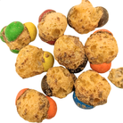 A pile of freeze dried caramel and chocolate candy on a white background