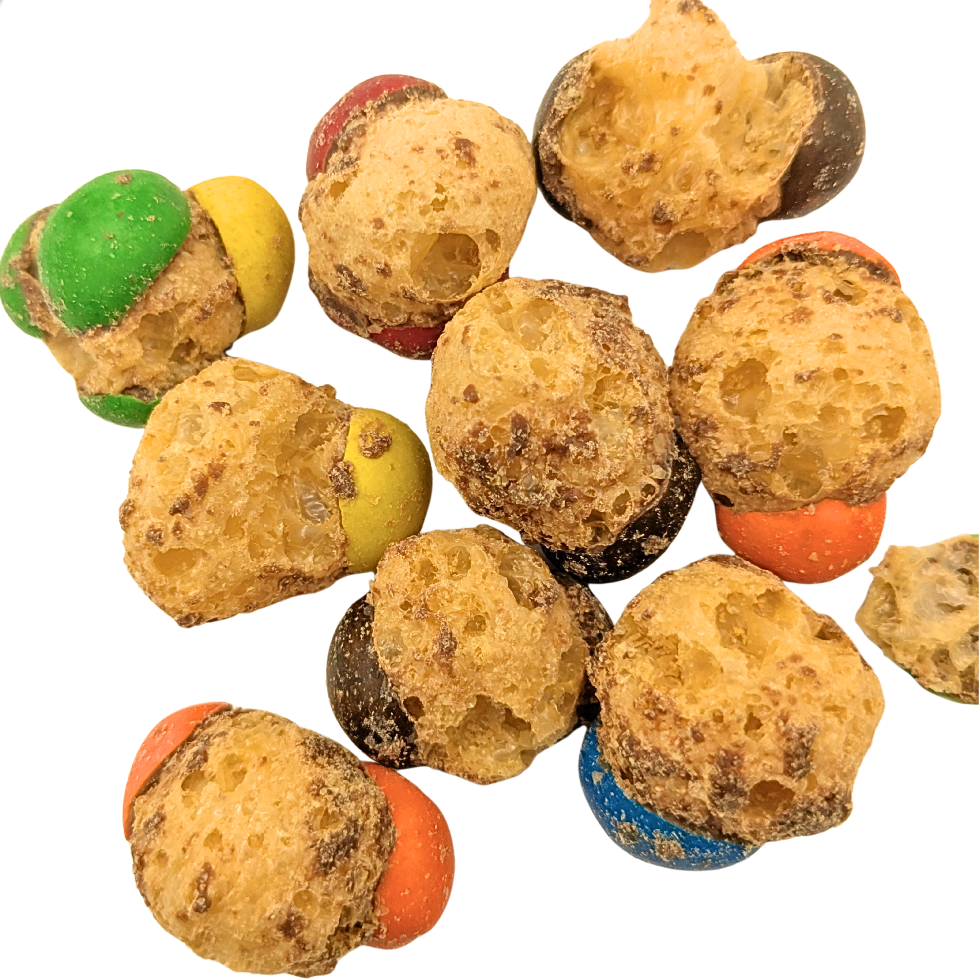 A pile of freeze dried caramel and chocolate candy on a white background