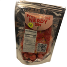 A silver resealable pouch of Freeze Dried Nerdy Bitz, featuring a pinkish-orange label with red text, a yellow '$7' sticker, and a QR code, set against a plain white background.