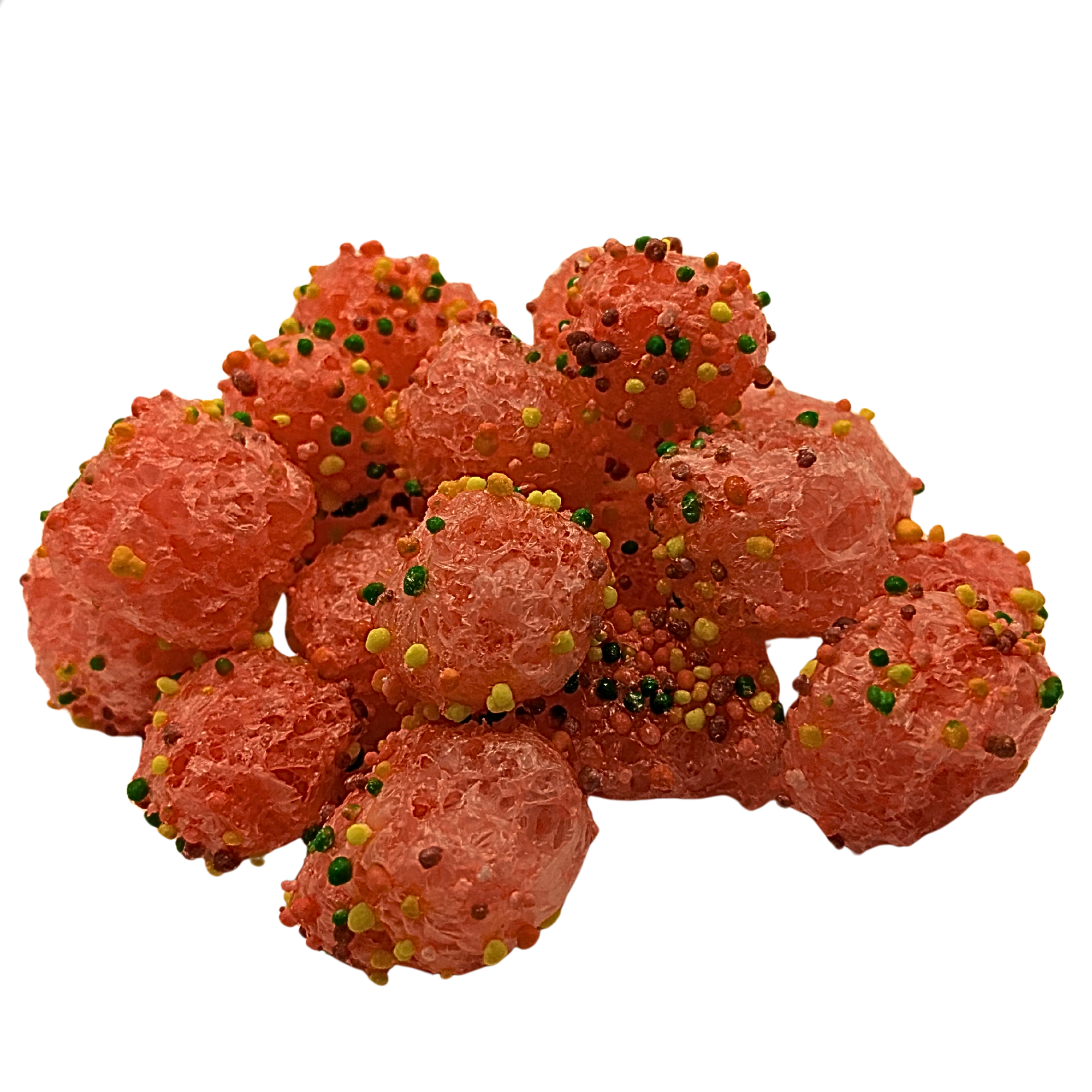 A pile of orange-red candy topped with multicolored sprinkles, isolated on a white background.