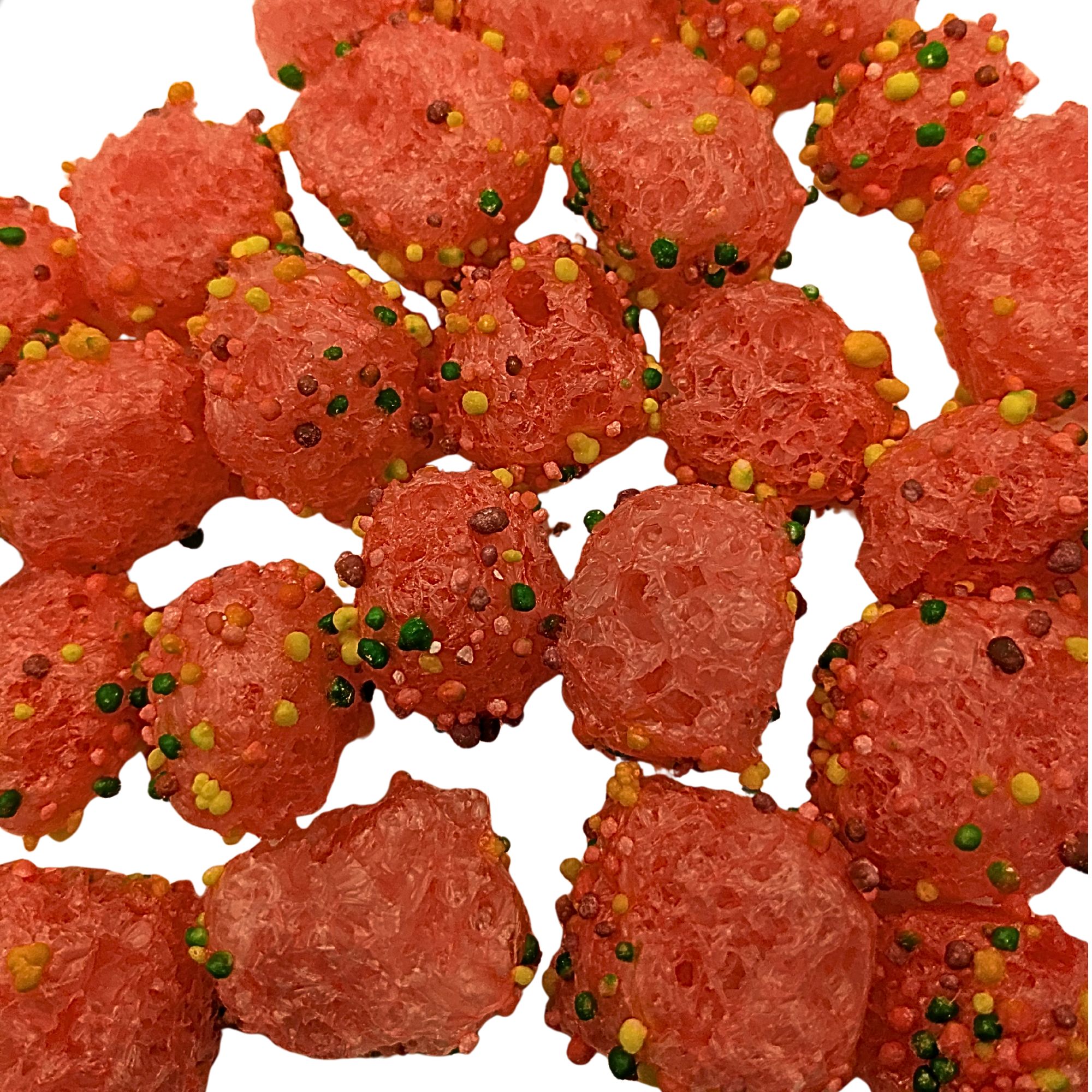 A close-up pile of bright pink candy sprinkled with multicolored round sprinkles, set against a plain white background.