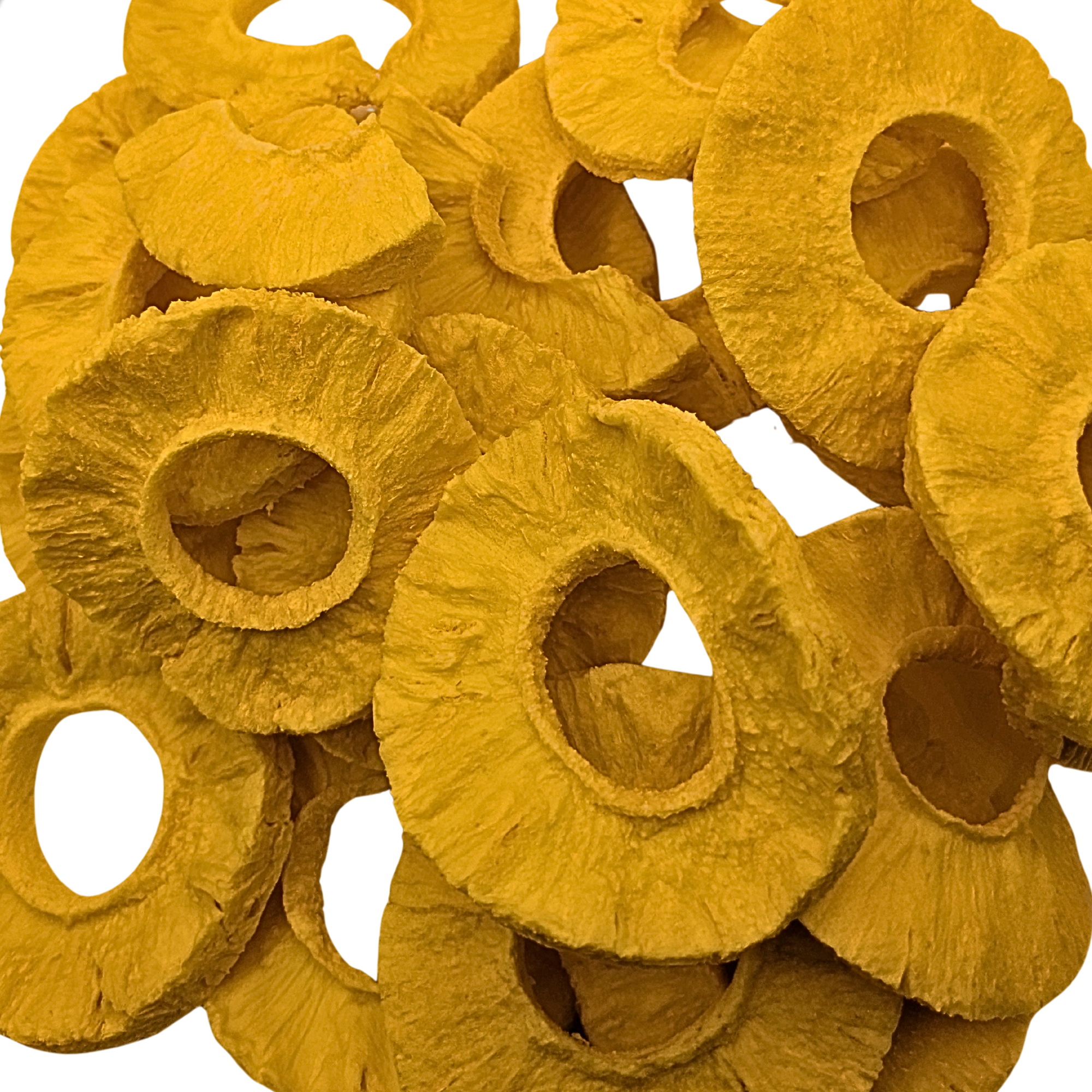 A pile of freeze dried pineapple slices, showing their characteristic textured yellow-orange rings on a solid white background.