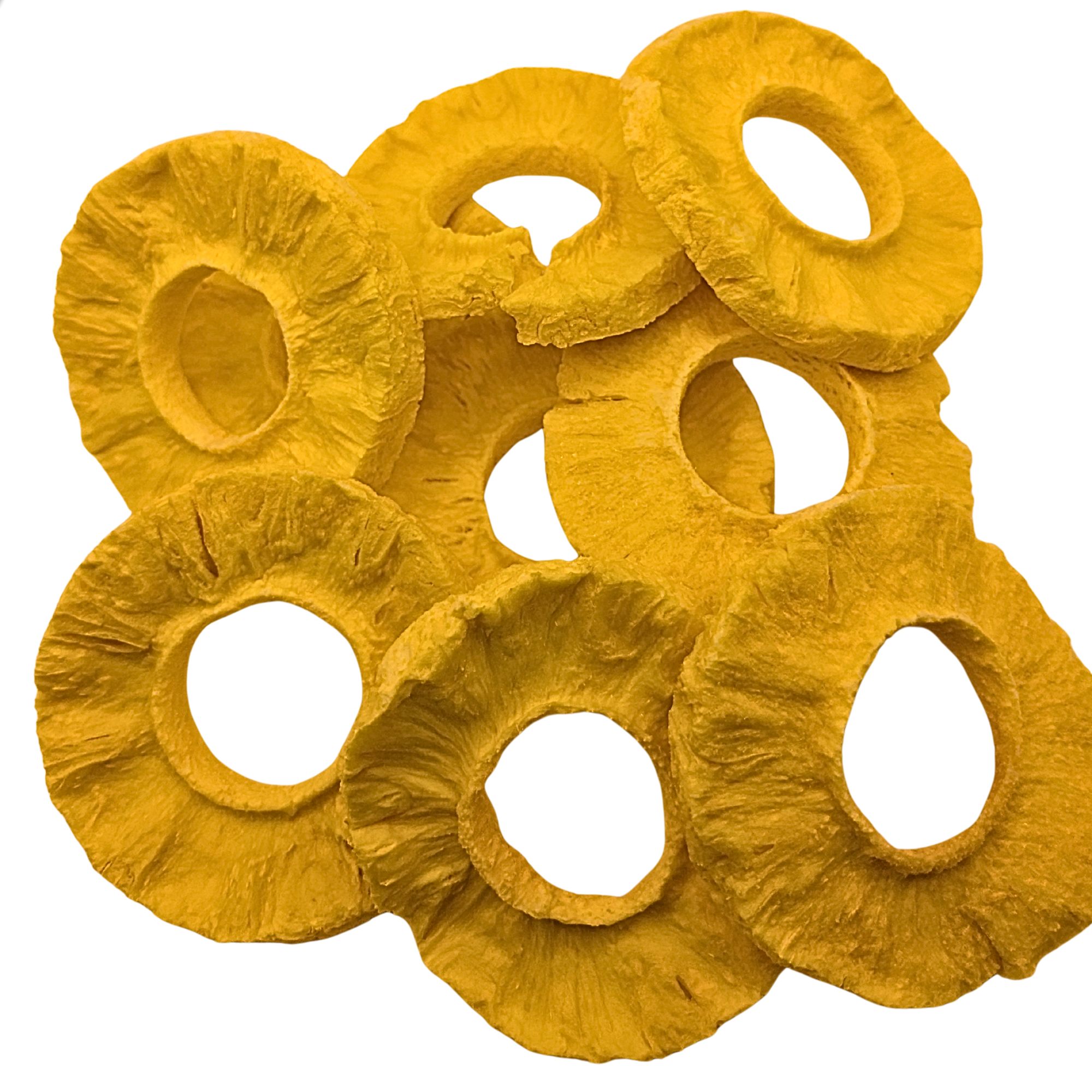 A pile of freeze dried pineapple slices, cut into circular rings, shown on a solid white background.