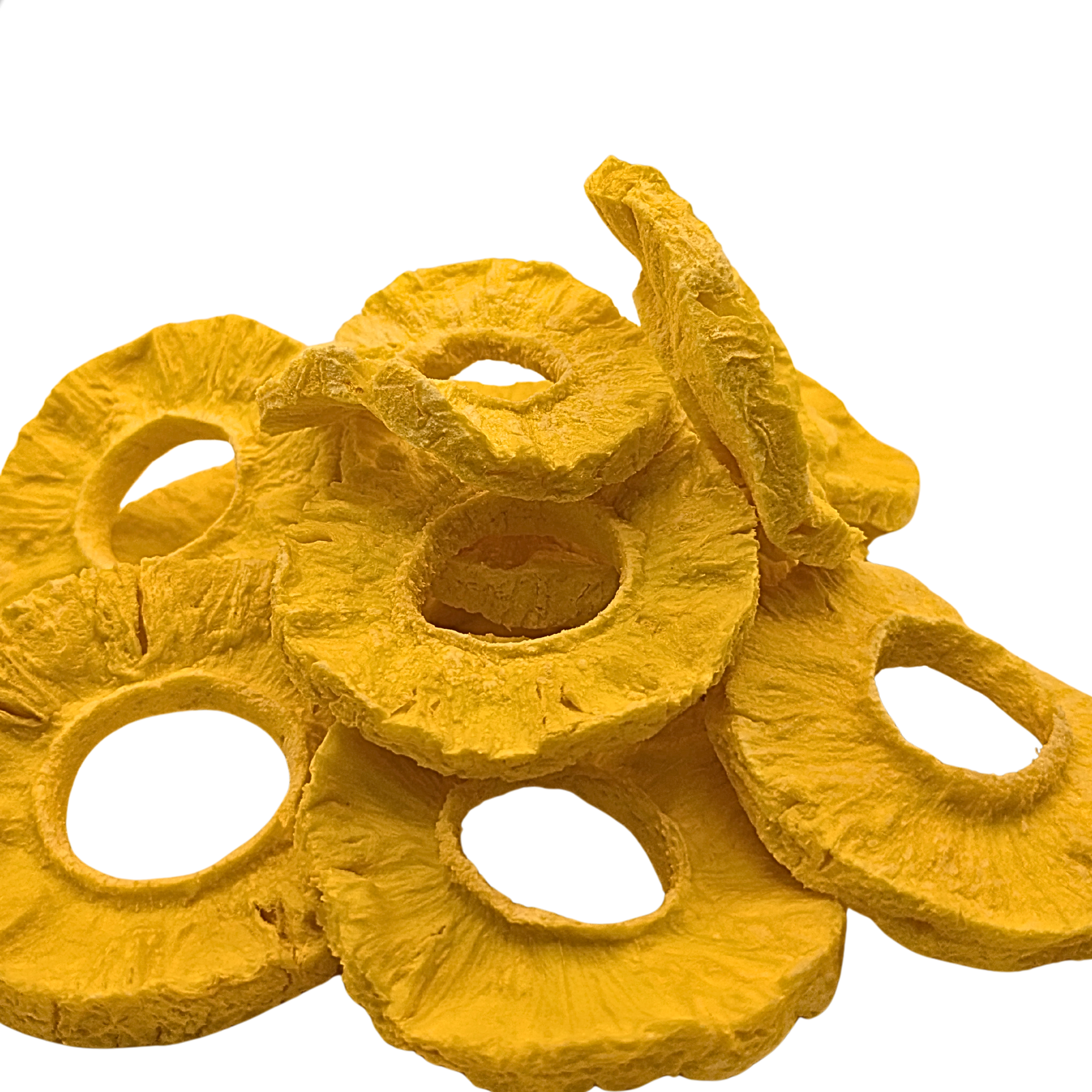 A pile of freeze dried pineapple slices in a bright yellow color, isolated on a white background.