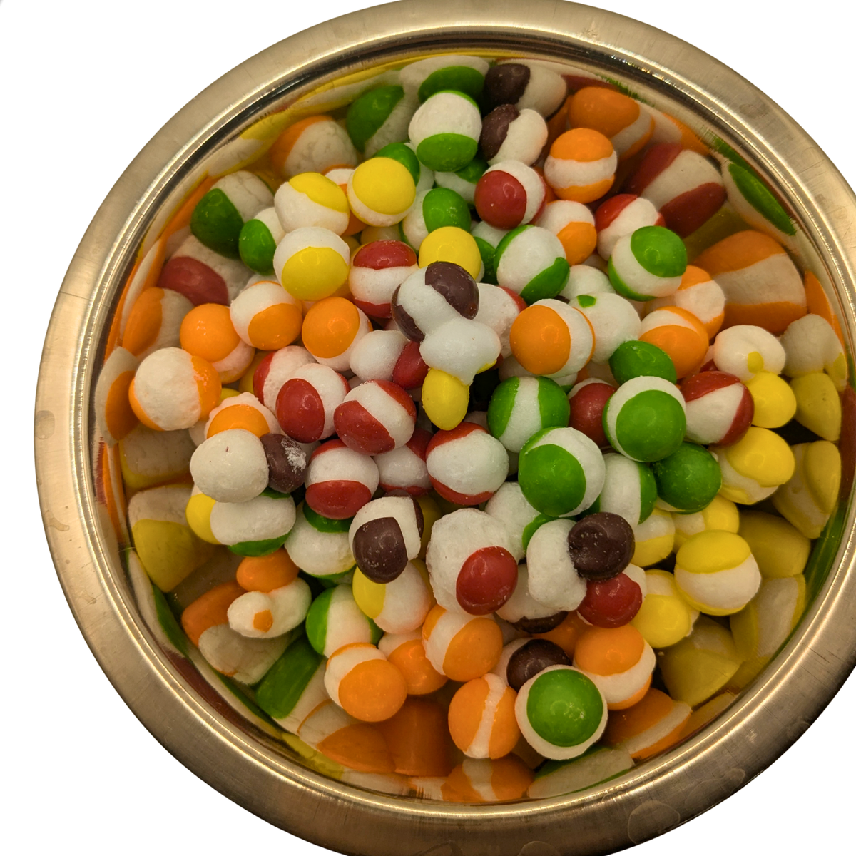 A bowl of freeze dried spherical candy with a white center and yellow, orange, red, green, and purple shells 
