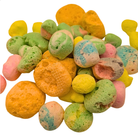 Pile of assorted freeze dried taffy on a white background