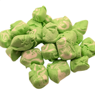 Pile of freeze dried key lime taffy on a white background