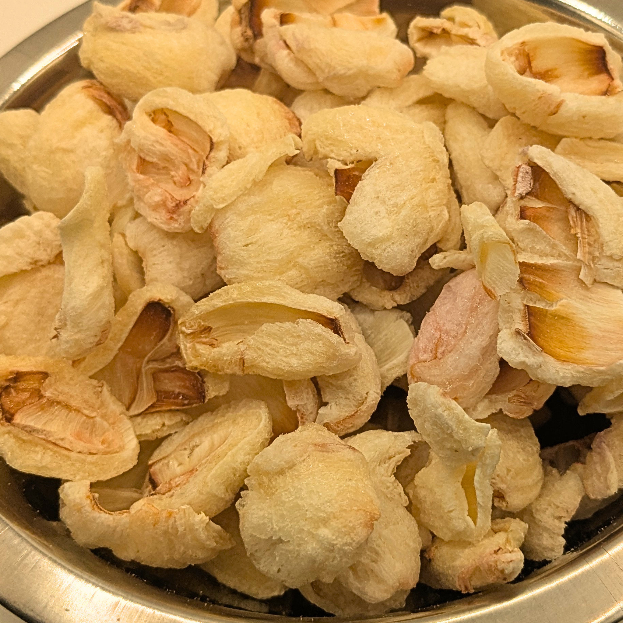 Close up of freeze dried lychee berries in a metal bowl