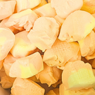 Freeze dried mango taffy, which is light orange and yellow with a fluffy texture